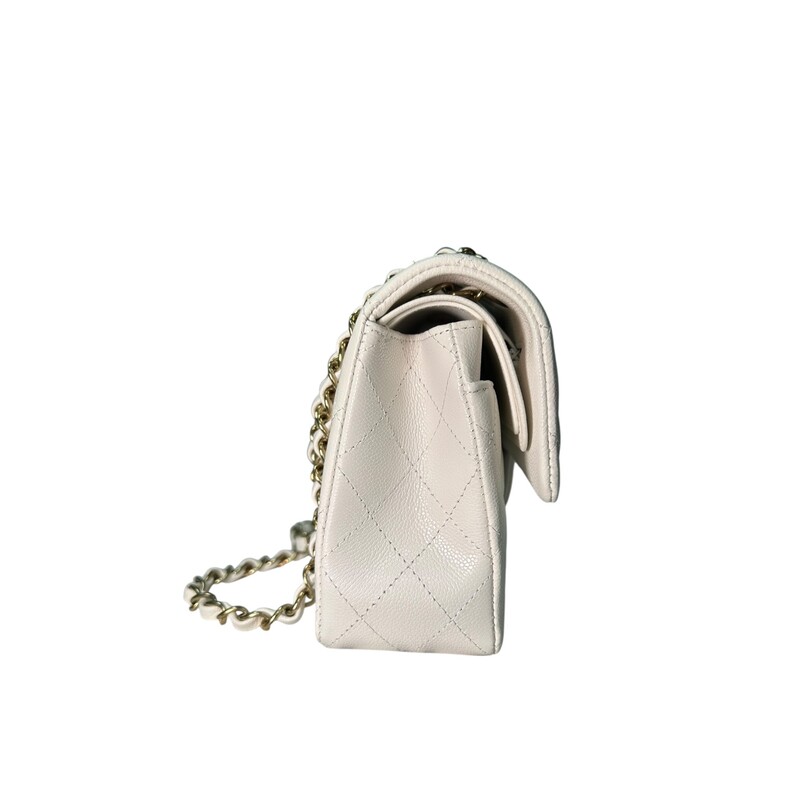 Chanel Double Flap White Veau Leather Chain Bag<br />
<br />
Serial Code TEK*****<br />
<br />
Dimensions: 9 L x 5.7 H inches<br />
<br />
In excellent condition. Like New.<br />
<br />
Comes with the original dust bag and box.