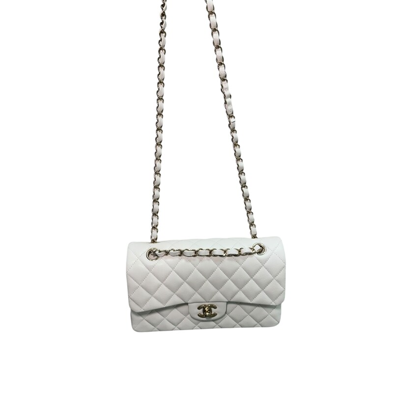 Chanel Double Flap White Veau Leather Chain Bag<br />
<br />
Serial Code TEK*****<br />
<br />
Dimensions: 9 L x 5.7 H inches<br />
<br />
In excellent condition. Like New.<br />
<br />
Comes with the original dust bag and box.