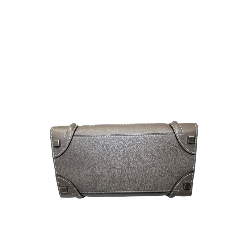 Celine Micro Luggage Tote<br />
<br />
Serial Code: SAT 0117<br />
<br />
Dimensions:<br />
Base length: 11 in<br />
Height: 11 in<br />
Width: 6 in<br />
Drop: 4.75 in<br />
<br />
In very good condition. Minor corner wear. Top handle deformation from improper storage.<br />
<br />
Comes with the original dust bag. No box.