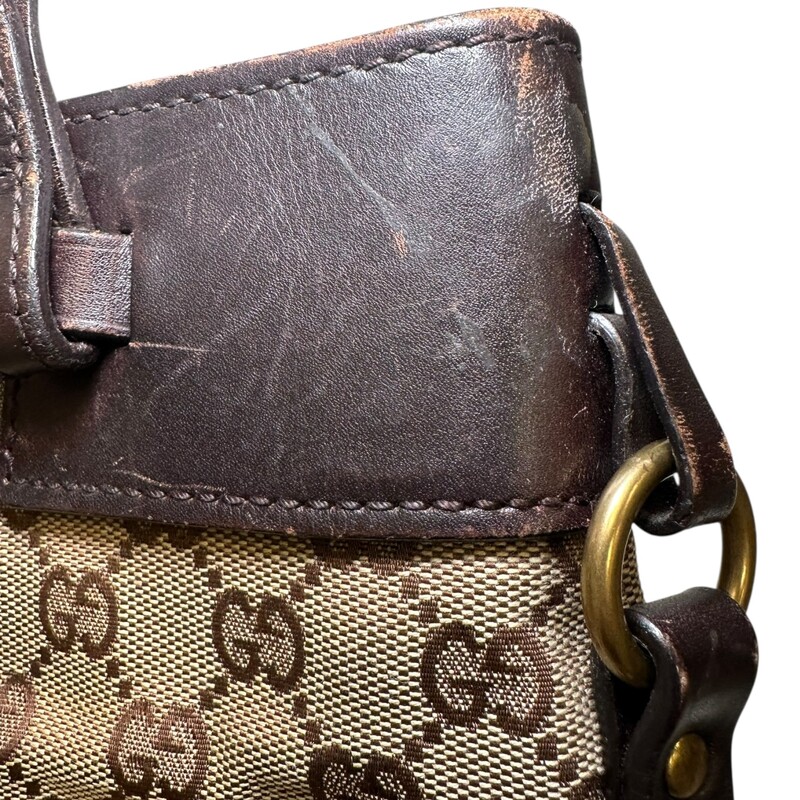 Gucci Canvas Belt  Monogram Tote<br />
<br />
Style Code: 107757 213048<br />
<br />
Dimensions: 12L X 10.5H X 4W<br />
<br />
In very good condition. Scratches on the leather.<br />
<br />
Does not come with original dust bag or box