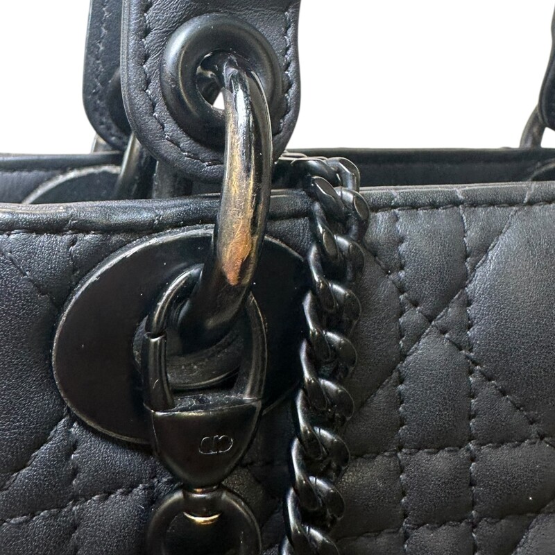 Dior Lady Dior Black Ultramatte Cannage Calfskin Mini<br />
<br />
Serial Code:15- BO-1119<br />
<br />
Dimensions: 6.5 L  x 6 H  x 3 W inches<br />
<br />
In good condition. Wear and fading of the hardware throuhgout the bag. Interior marks and stains.<br />
<br />
Comes with the original dust bag. No Box.