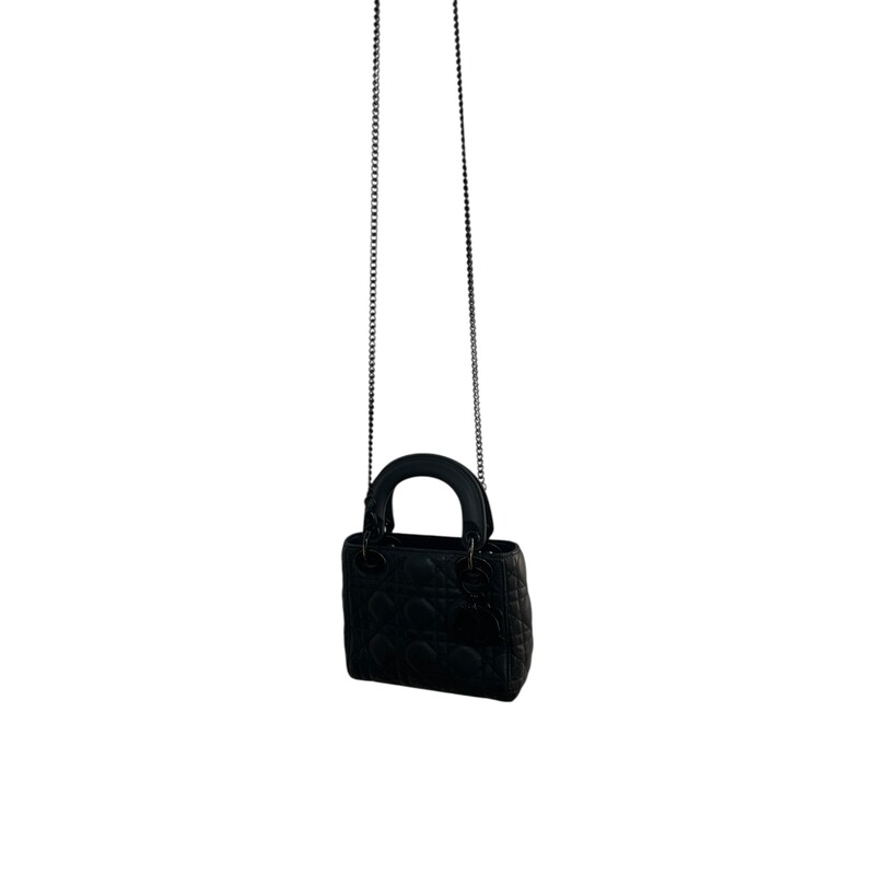 Dior Lady Dior Black Ultramatte Cannage Calfskin Mini<br />
<br />
Serial Code:15- BO-1119<br />
<br />
Dimensions: 6.5 L  x 6 H  x 3 W inches<br />
<br />
In good condition. Wear and fading of the hardware throuhgout the bag. Interior marks and stains.<br />
<br />
Comes with the original dust bag. No Box.