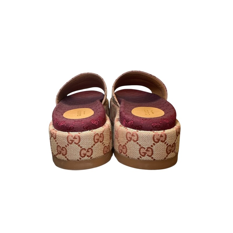 Gucci Angelina Platform Monogram Slides<br />
<br />
Style Code:573018 09 B<br />
<br />
In very good condition. Some minor marks on bottoms.<br />
<br />
Comes with the original box and dust bag.
