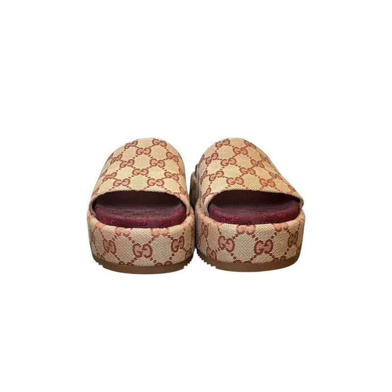 Gucci Angelina Platform Monogram Slides<br />
<br />
Style Code:573018 09 B<br />
<br />
In very good condition. Some minor marks on bottoms.<br />
<br />
Comes with the original box and dust bag.