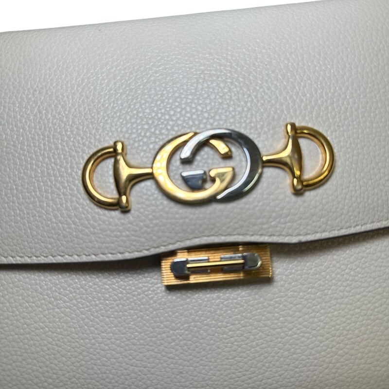 Gucci Zumi Grainy Leather Crossbody<br />
<br />
Style Code: 576388 000926<br />
<br />
Dimensions: 10 L X 7 H inches<br />
<br />
In very good condition. Some scratching of the hardware and some interior marks.<br />
<br />
Does not come with original dust bag or box.