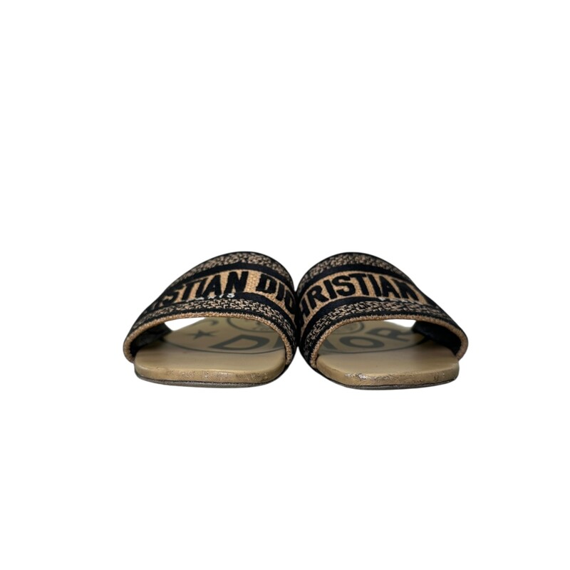 Dior Dway Slide Tan<br />
<br />
Size: 37<br />
<br />
Code: MD0422<br />
<br />
In good condition. Major wear to the leather on the front of the toes. Wear to the soles interior and exterior.<br />
<br />
Comes with the original dust bag and box.