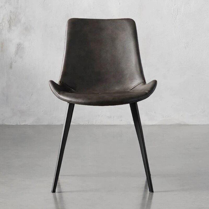 Set of 4 Arhaus Gage Leather Dining Chairs<br />
Brown Black Size: 20 x 22.5 x 31H<br />
Retails: $520 for one, $2080 for 4<br />
Color: Carbon<br />
As Is - small rub spot on two of the chairs<br />
<br />
Our Gage Dining Seating Collection features an iconic scoop-seat silhouette accented by baseball-style stitching. Upholstered in faux leather, Gage’s seat is complemented by an iron frame with a uniquely textured, powder-coated finish designed to hold up to everyday wear.<br />
Upholstered in faux leather accented with baseball-style stitching.<br />
Iron frame features a powder-coated finish for added durability.