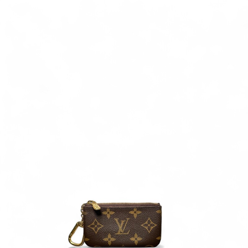 Louis Vuitton Monogram Key Pouch

Dimensions: 5.9  L x3.3 H inches

In good condition. Light scratching and tarnishing of
hardware.

Does not come with original dust bag or box.