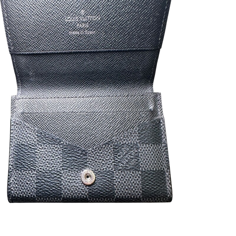Louis Vuitton Envelope Card Holder Graphite<br />
<br />
Chipped<br />
<br />
Dimensions:<br />
4.1 x 3.1 x 0.4 inches<br />
(Length x Height x Width)<br />
<br />
In very good condition. The snap pops easily but still functional.<br />
<br />
Comes with the original dust bag and box.
