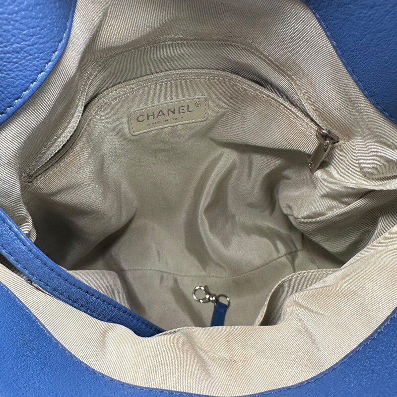 Chanel Around Hobo Quilted Chain  Washed Lambskin<br />
<br />
Serial Code:15xxxxxx<br />
<br />
Dimensions: 10 L x 9 H inches<br />
<br />
In fair condition. Some color discolration on the back of the bag. Minor interior marks. Hardware scratches.<br />
<br />
Does not come with original dust bag or box.