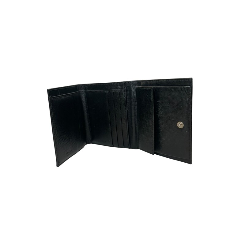 Prada Nylon Compact Wallet<br />
<br />
Dimensions: 4 L x  4 H inches<br />
<br />
In very good condition. Some wear on the nylon<br />
<br />
Does not come with the original dust bag or box,