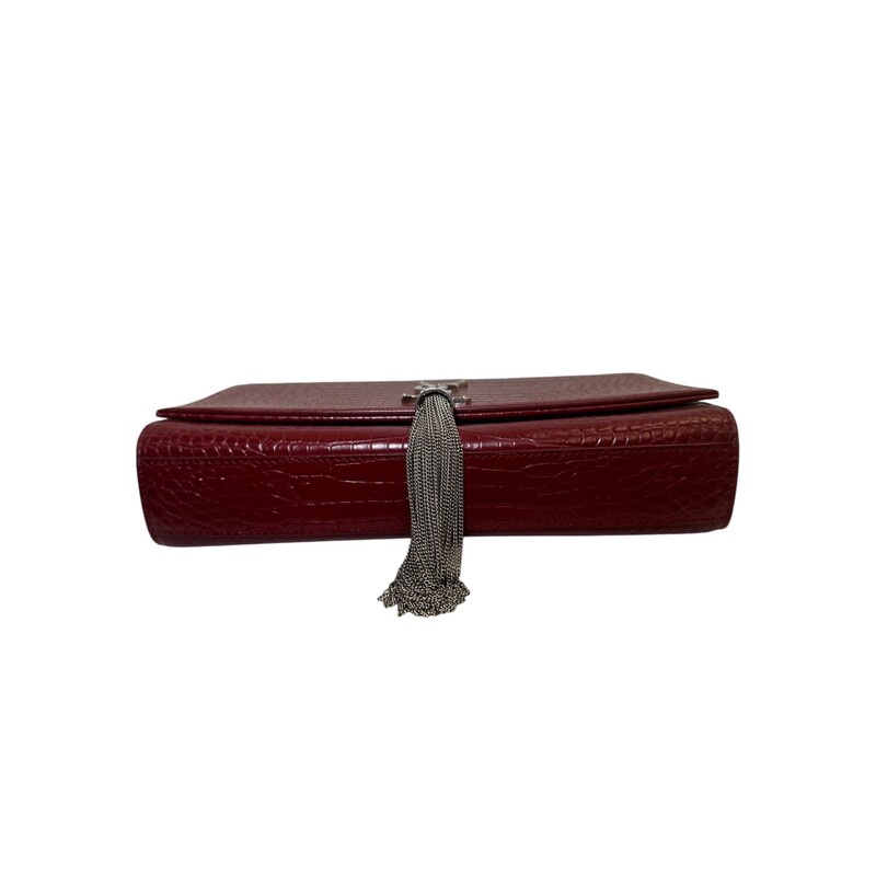 Saint Laurent Croc Embossed So kate Tassle Bag<br />
<br />
Serial Code: TCT3541190517<br />
<br />
Dimensions: 5.7H x 9.4W x 2.1D.<br />
<br />
In excellent condition. Some scratching on the hardware.<br />
<br />
Does not come with the original dust bag or box.