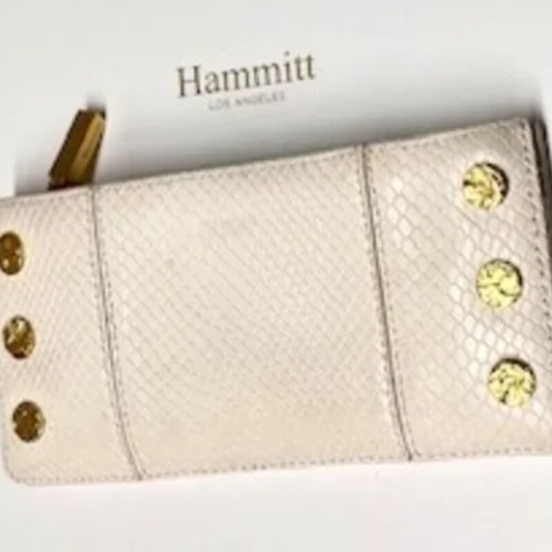 Hammit 110 North Wallet
Cream Snake Skin
Size: 7.5x.5x3.5H
Classic pebbled leather in a white hue
Red cotton twill lining
Brushed gold hardware, functionality covered for life
Exterior: Magnetic closure, zippered pocket
Interior: Two drop pockets, ten credit card slots, one transparent ID slot.
Retail $275