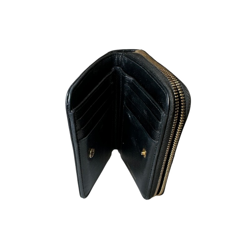 Saint Laurent Cassandre Compact Zip Wallet<br />
<br />
Serial Code:GNC403723.0517<br />
<br />
Dimensions: 5 L x 3 H inches<br />
<br />
In good condition. Some discoloration of the hardware. Some interior marks and slight stickyness of the leather.<br />
<br />
Does not come with the original dust bag or box.