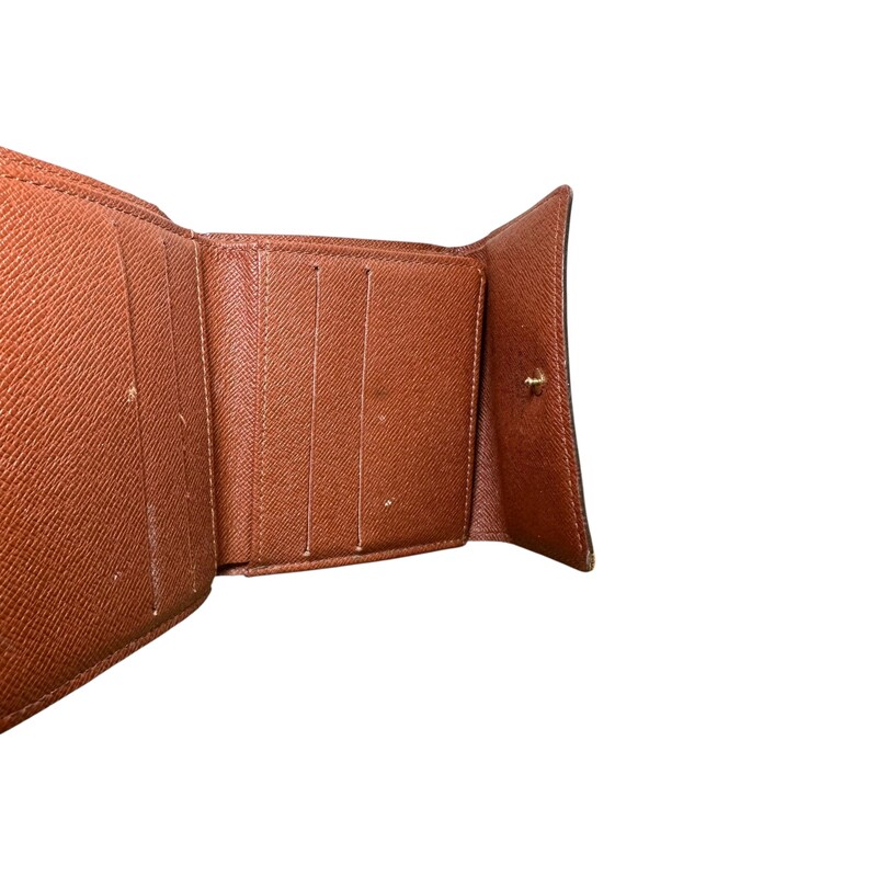 Louis Vuitton Elise Monogram Wallet<br />
<br />
Code: SD0032<br />
<br />
Dimensions:<br />
Length: 4.25 in<br />
Width: 1.00 in<br />
Height: 4.00 in<br />
<br />
In very good condition. Light wear to the corners and piping.<br />
<br />
Comes with the original dust bag.