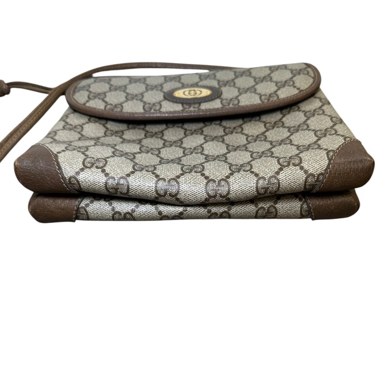 Gucci Vintage Logo Canvas and leather Strap bag<br />
<br />
Serial Code:007.49.5548<br />
<br />
Dimensions: 8 L x 6 H inches<br />
<br />
In very good condition. Some corner wear/<br />
<br />
Does not come with original dust bag or box.