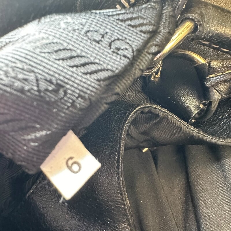 Prada Tuessto Moon Hobo Shoulder Bag<br />
<br />
Factory Code: 7/6<br />
<br />
Dimensions: 15 L x 13 H inches<br />
<br />
In very good condition. Light scratching of the hardware.<br />
<br />
Does not come with the original dust bag or box.
