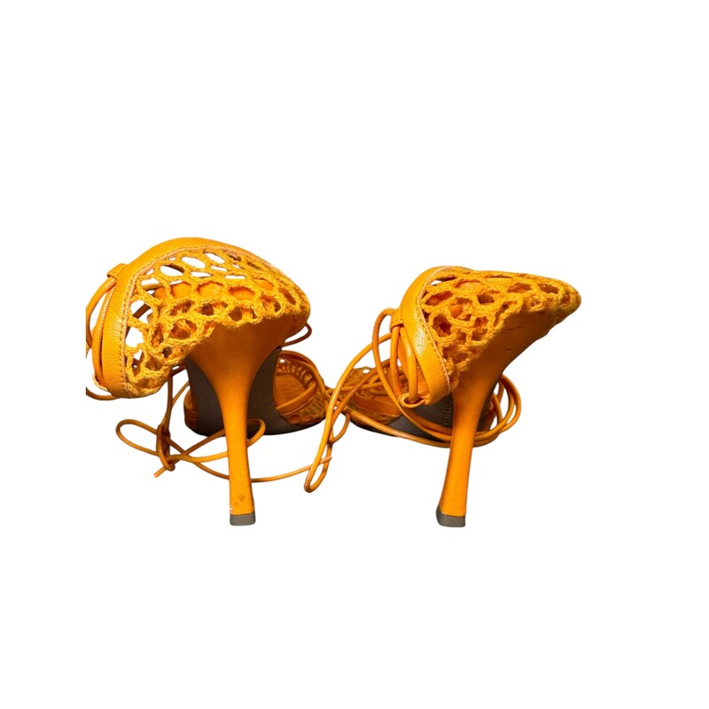 Bottega Venetta Stretch Lace Orange Heels<br />
<br />
Size 38<br />
<br />
In good condition. Light wear to the corner leather and light scuffs on back heels.<br />
<br />
Comes with the original dust bag. No box.