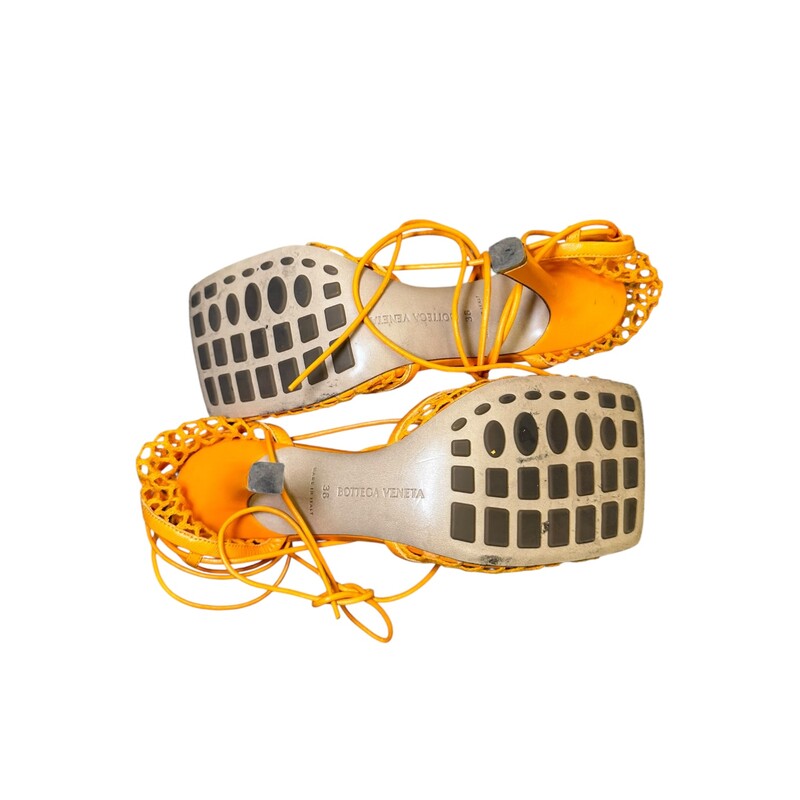 Bottega Venetta Stretch Lace Orange Heels<br />
<br />
Size 38<br />
<br />
In good condition. Light wear to the corner leather and light scuffs on back heels.<br />
<br />
Comes with the original dust bag. No box.