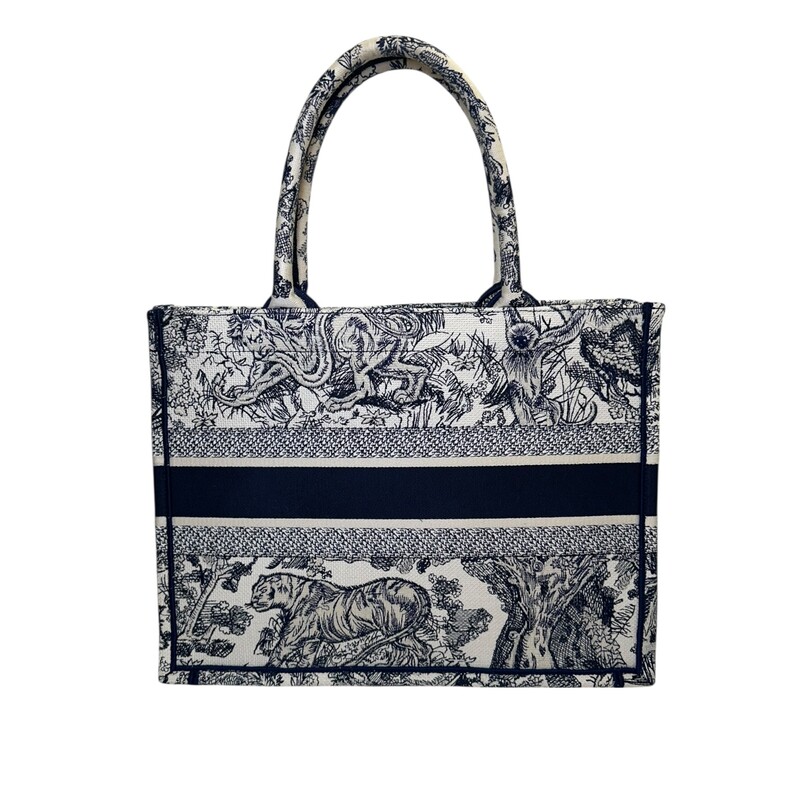 Dior Book Toile De Jouy Navy Tote<br />
<br />
Code:<br />
50-MA-0223<br />
<br />
Dimensions:<br />
14 x 11 x 6.5 inches<br />
<br />
In excellent condition. On light mark by handles.<br />
<br />
Comes with the original dust bag. No box.