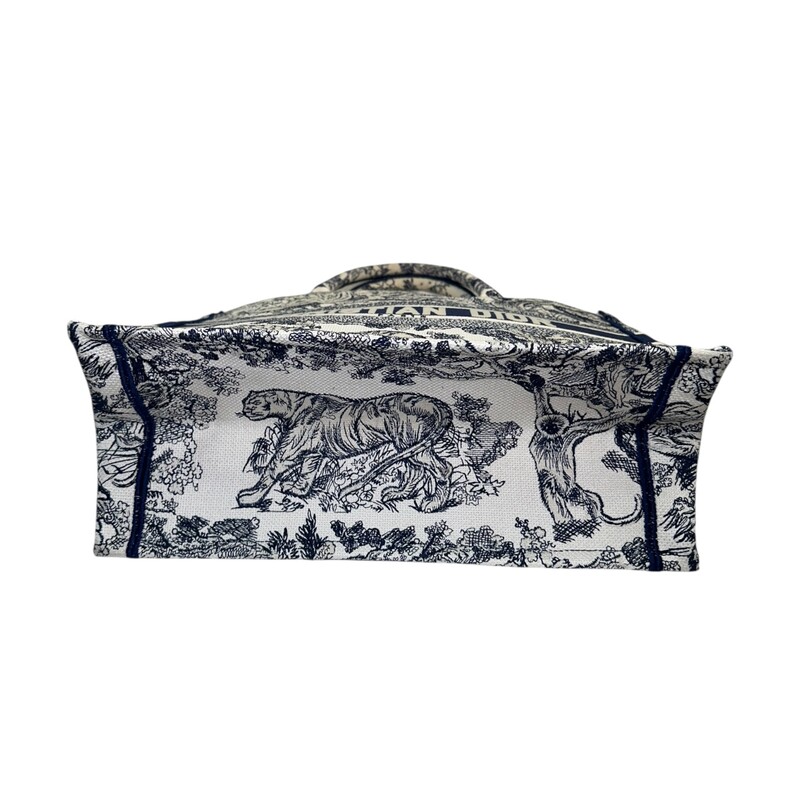 Dior Book Toile De Jouy Navy Tote<br />
<br />
Code:<br />
50-MA-0223<br />
<br />
Dimensions:<br />
14 x 11 x 6.5 inches<br />
<br />
In excellent condition. On light mark by handles.<br />
<br />
Comes with the original dust bag. No box.