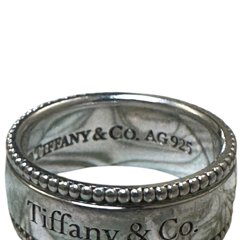 Tiffany & Co Beaded Edge Ring<br />
<br />
Sterling Silver<br />
<br />
Size 6<br />
<br />
In  very good condition. Some minor scratches on the hardware.<br />
<br />
Does not come with the original dust bag or box.