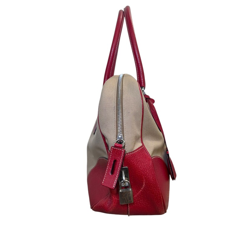 Prada Cinghiale Trimmed Canapa Bowler Bag<br />
<br />
Factory Code: 31<br />
<br />
Dimensions: 13 L x 7 H inches<br />
<br />
In very good condition. Some scratches on the leather.<br />
<br />
Comes with the original dust bag and box.