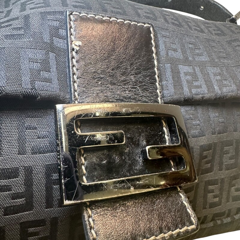Fendi Baguette Zucca Black Shoulder Bag<br />
<br />
Dimensions: 10 L x 6 H inches<br />
<br />
In good condition. Some scratching of the hardware and<br />
some kinking of the strap.<br />
<br />
Does not come with the original dust bag or box