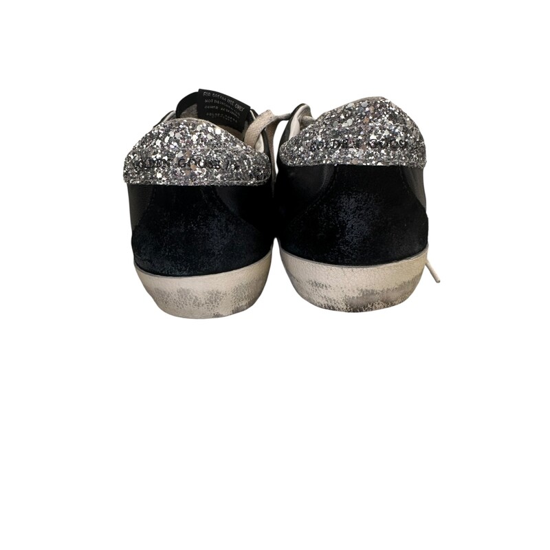 Golden Goose Super Star Black & Silver Sneakers<br />
<br />
Size: 39<br />
<br />
In very good condition.<br />
<br />
Does not come with the original dust bag or box.