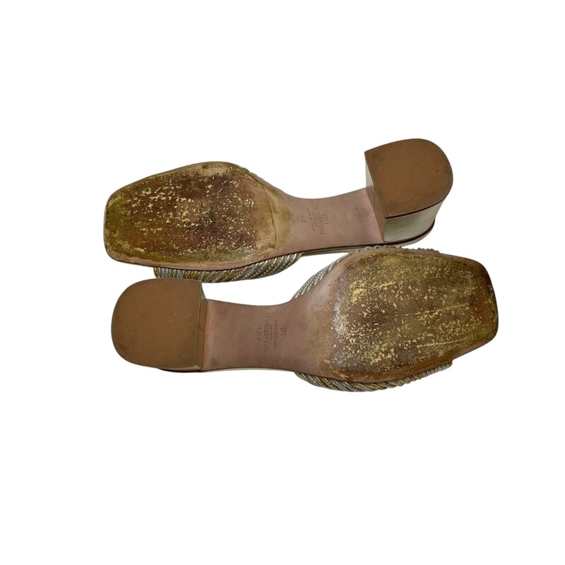 Valentino Medallion Slide Metallic Heels

Size: 40

Codes: EX 6 HA6

In very good condition. Light scuffs to the heels. And wear to the bottom of the shoes.

Does not come with the original dust bag or box.