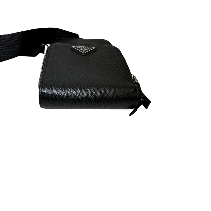 Prada Smart Phone Saffiano Black Leather Crossbody<br />
<br />
Code: 12<br />
<br />
Dimensions:<br />
4.5inW x 7inH x 1inD<br />
<br />
In very good condition. Light piling to the edge by the zipper.<br />
<br />
Does not come with the original dust bag or box.