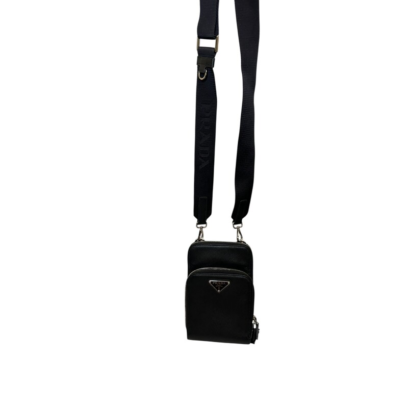 Prada Smart Phone Saffiano Black Leather Crossbody<br />
<br />
Code: 12<br />
<br />
Dimensions:<br />
4.5inW x 7inH x 1inD<br />
<br />
In very good condition. Light piling to the edge by the zipper.<br />
<br />
Does not come with the original dust bag or box.