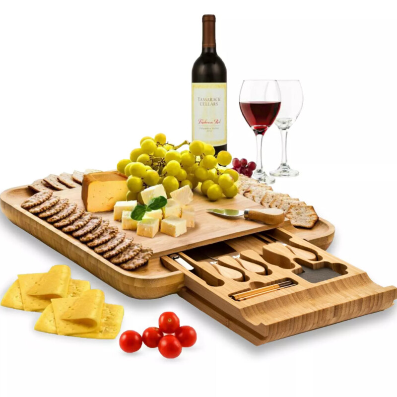 Bambusi Wood Cheeseboard With Knives
Tan Size: 13 x 13H
Retails: $40