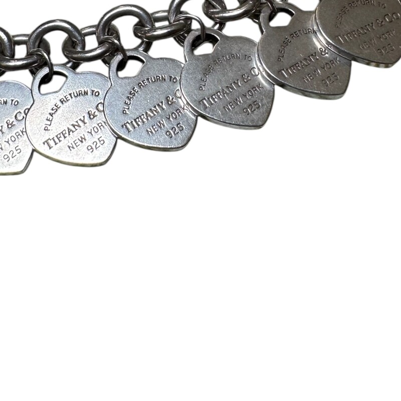 Tiffany & Co Please Return to Tiffany Mulitple Heart

Bracelet

Composition: Sterling Silver

In excellent shape. Minor surface scratches. Light scrach dent by clasp.

Comes with the original dust bag. No box.