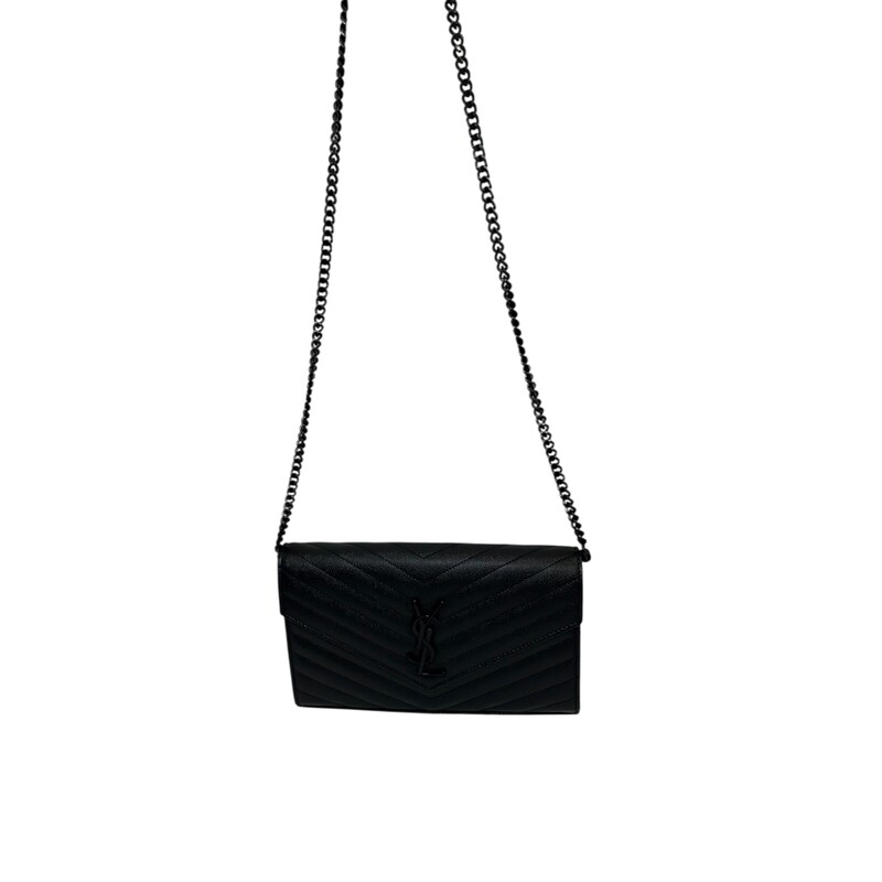 Saint Laurent Cassandre Black Woc<br />
<br />
Serial Code:GUE377828.0121<br />
<br />
Dimensions:8.5 L x 5.5 H inches<br />
<br />
In very good condition. Light scratching on the hardware. Scratching on inside.<br />
<br />
Does not come with the original dust bag or box