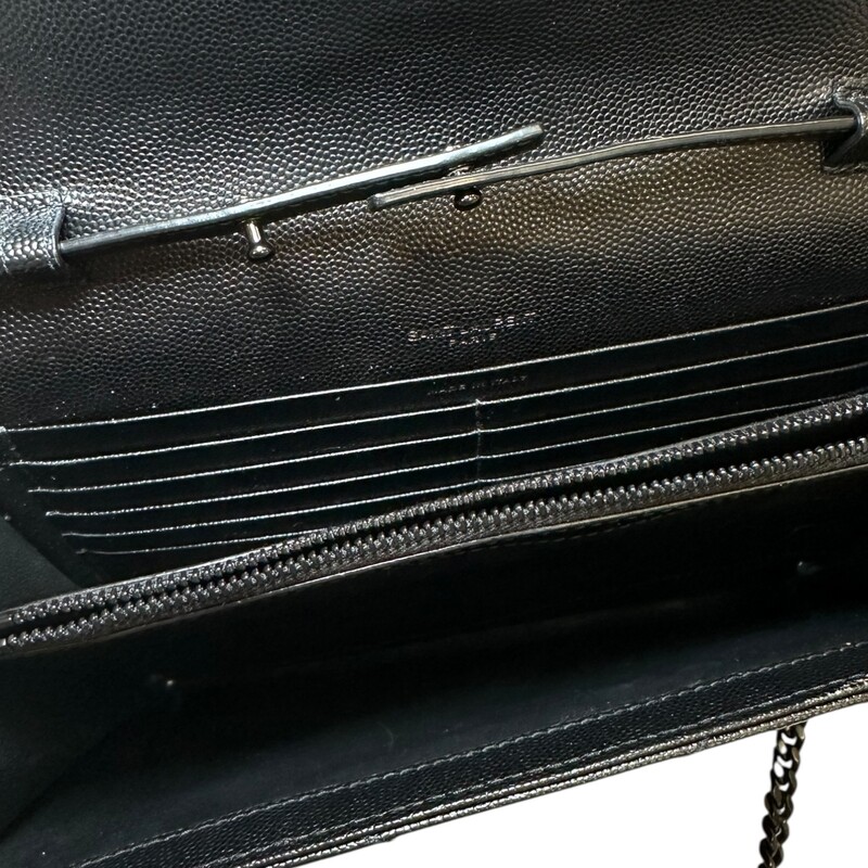 Saint Laurent Cassandre Black Woc<br />
<br />
Serial Code:GUE377828.0121<br />
<br />
Dimensions:8.5 L x 5.5 H inches<br />
<br />
In very good condition. Light scratching on the hardware. Scratching on inside.<br />
<br />
Does not come with the original dust bag or box