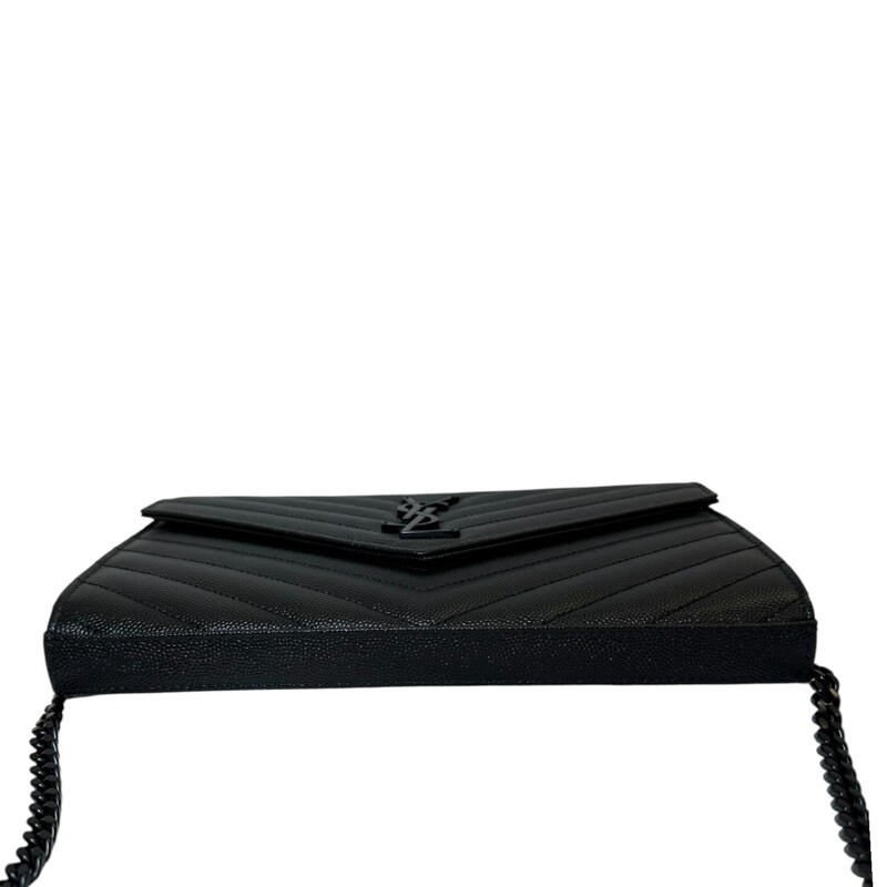 Saint Laurent Cassandre Black Woc<br />
<br />
Serial Code:GUE377828.0121<br />
<br />
Dimensions:8.5 L x 5.5 H inches<br />
<br />
In very good condition. Light scratching on the hardware. Scratching on inside.<br />
<br />
Does not come with the original dust bag or box