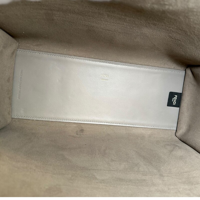 Fendi Sunshine Grey Leather Tote With Strap<br />
<br />
Style Code:98H386 ABVI2212085<br />
<br />
Dimensions: 14 L x 12 H inches<br />
<br />
In very good condition. Some scratching on the hardware.<br />
<br />
Comes witrh the original dust bag and box.