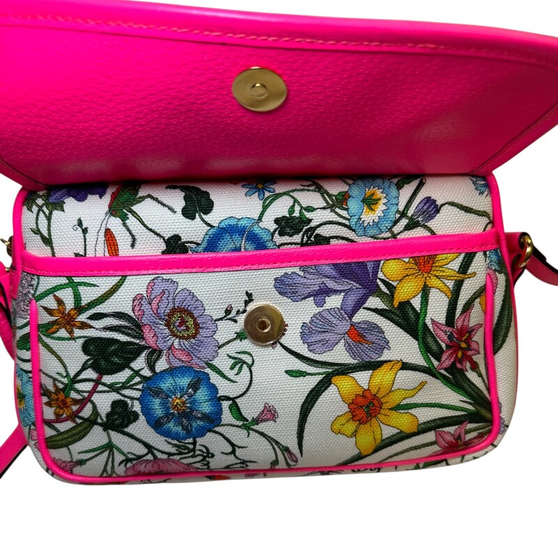 Gucci Flora Canvas Bag Pink trim<br />
<br />
Style Code:550147 493492<br />
<br />
Dimensions:9L x 6 H inches<br />
<br />
In very good condition. Some minor scratching of the hardware and some interior marks<br />
<br />
Does not come with the orignal dust bag or box..