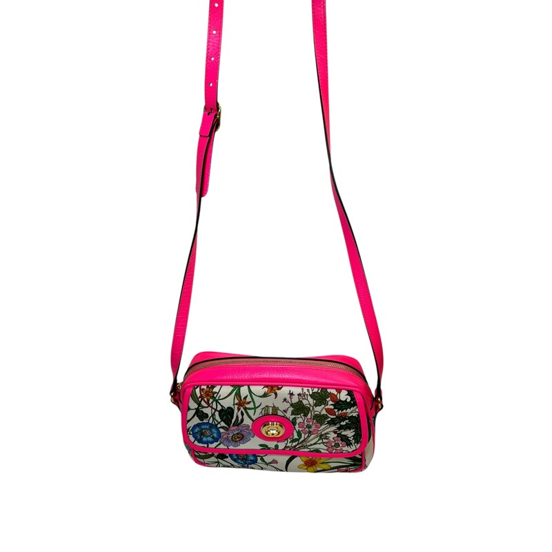 Gucci Flora Canvas Bag Pink trim<br />
<br />
Style Code:550147 493492<br />
<br />
Dimensions:9L x 6 H inches<br />
<br />
In very good condition. Some minor scratching of the hardware and some interior marks<br />
<br />
Does not come with the orignal dust bag or box..