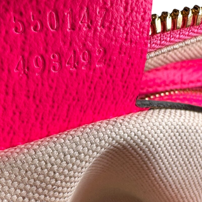 Gucci Flora Canvas Bag Pink trim<br />
<br />
Style Code:550147 493492<br />
<br />
Dimensions:9L x 6 H inches<br />
<br />
In very good condition. Some minor scratching of the hardware and some interior marks<br />
<br />
Does not come with the orignal dust bag or box..