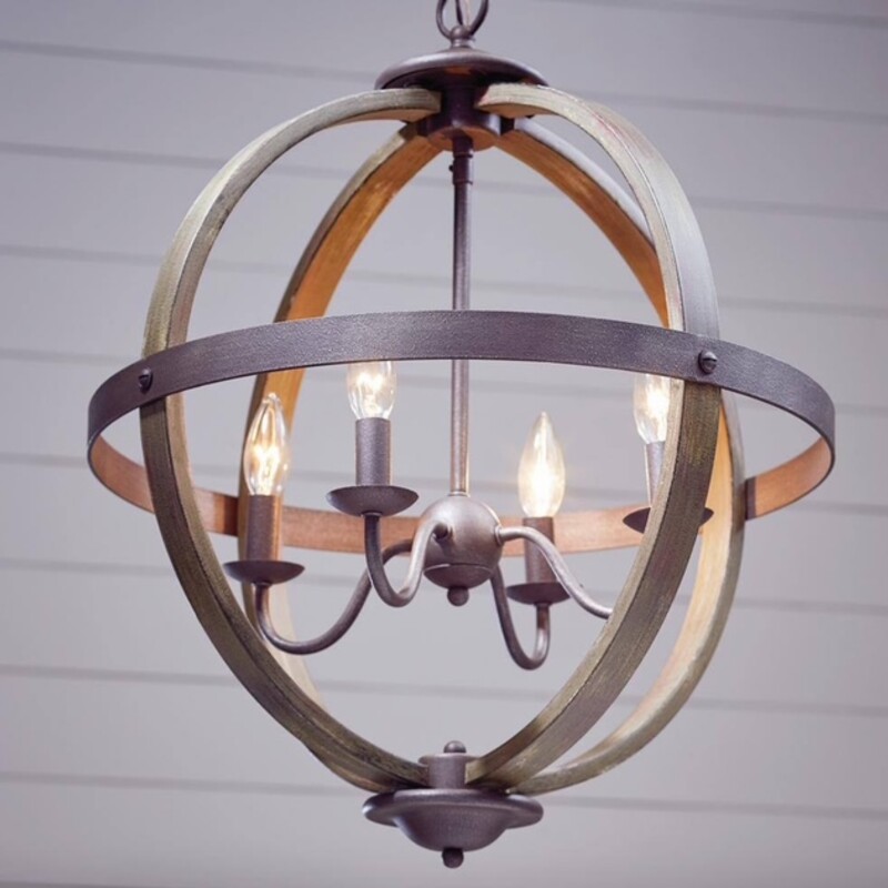 Artisan Elm Wood Iron Orb Chandelier
Gray Brown Size: 20 x 25H
Retails: $229+
This 4-light pendant makes a statement in a variety of interiors. A classically designed frame features a Artisan Iron finish with elm wood accents. Can be hung as a single fixture - or in groupings of 2 or more - to complement coastal, rustic and reclaimed design styles.