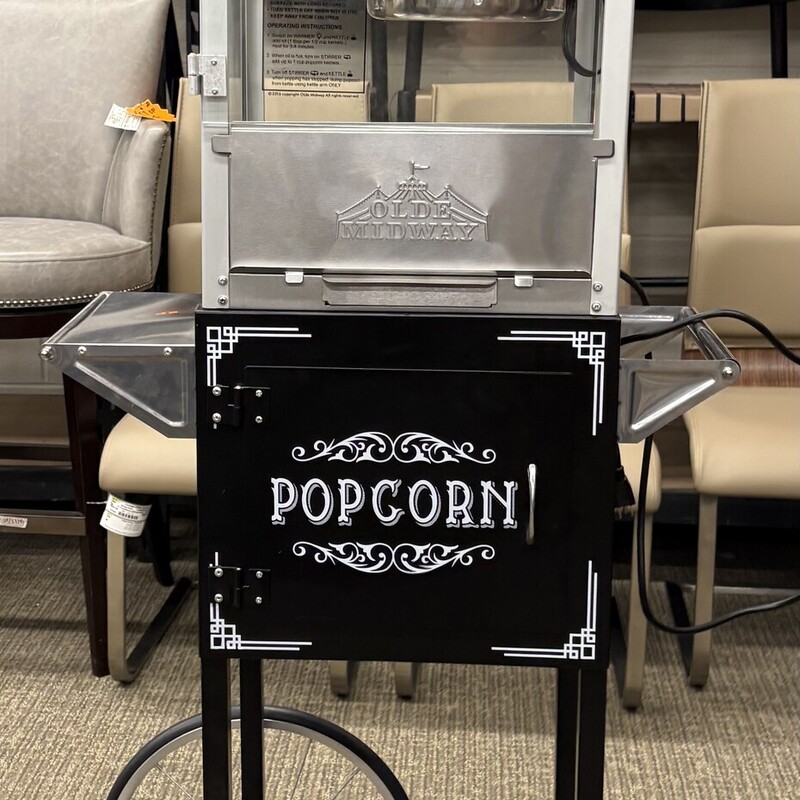 Olde Midway Popcorn Popper Cart<br />
Black White<br />
Size: 30x16x60H<br />
Fashioned with authentic antique style updated with modern features, this attractive popcorn machine not only offers visual appeal but lasting durability. Constructed of heavy-duty stainless steel, a whisper-quiet motor, 850 watts of power, and premium paint with a glossy finish, this machine's industry-leading 10-oz. kettle serves up to 4 gallons of popcorn per batch. The sturdy cart provides ample storage and features oversized wheels for easy transport.Easy, 3-switch design: Operation is simple with a 3-switch design, making popping fast and convenient. Switches include a spot light warmer, stirrer, and pot heater. Tempered safety glass: Tempered glass walls provide both protection and sturdiness, with superior resistance against scratching and warping.