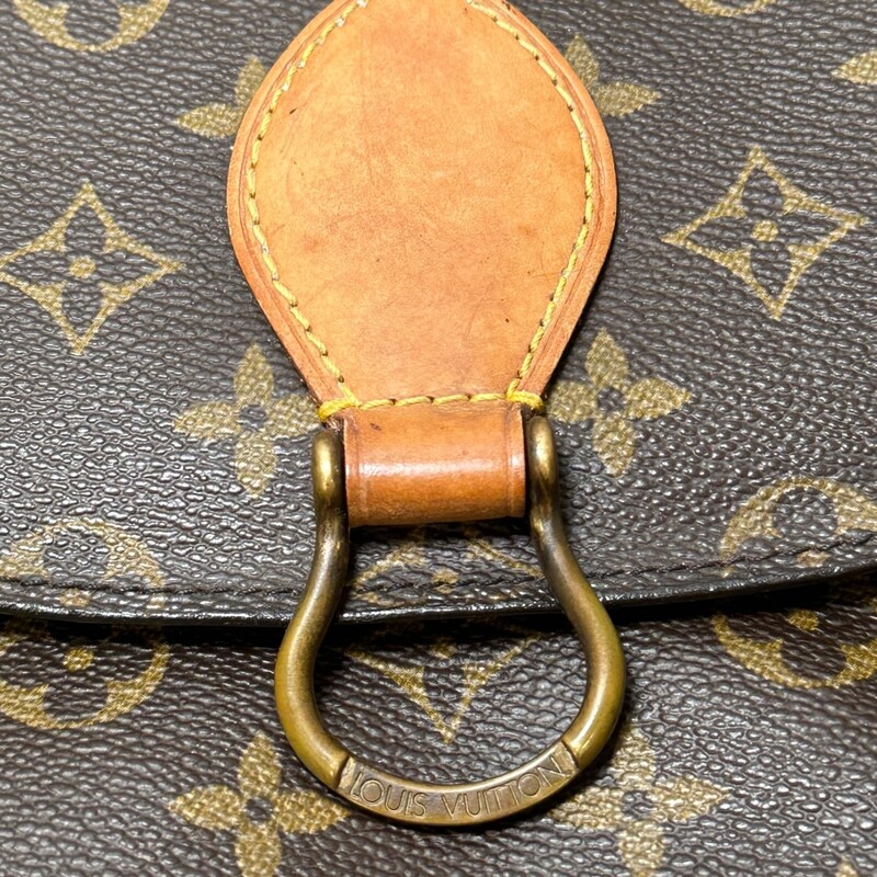 Louis Vuitton Saint Cloud  Monogram GM<br />
<br />
Date Code: TH0931<br />
<br />
Dimnensions:9 W x8.5 H x 2.7D inches<br />
<br />
In good condition. Some water marks on the leather and some interior peeling inside the interior pocket.<br />
<br />
Does not come with the original dust bag or box