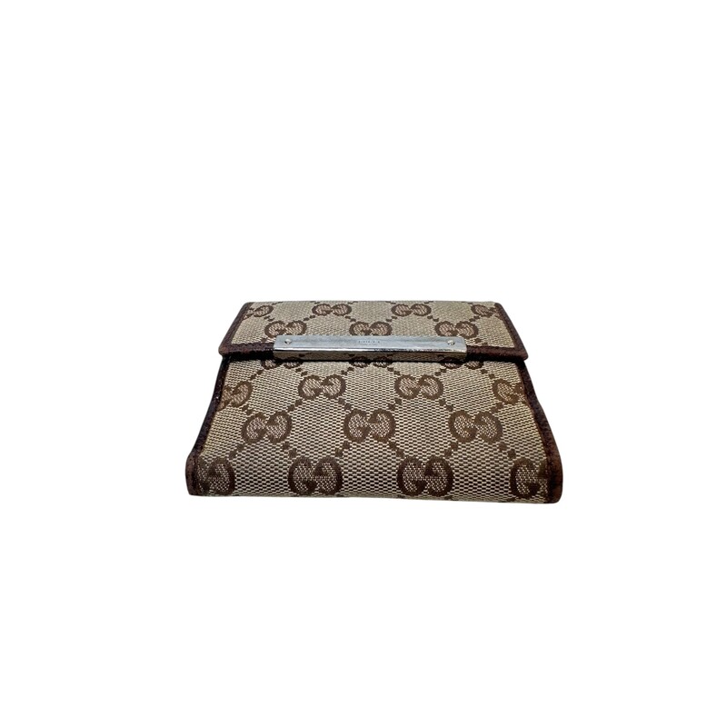 Gucci Metal French Monogram BiFold<br />
<br />
Date Code: 112716 1147<br />
<br />
Dimensions:<br />
Length: 4.25 in<br />
Height: 3.50 in<br />
Width: 1.00 in<br />
<br />
In good condition. Wear to the leather trims and scratching to the hardware.<br />
<br />
Does not come with the original dust bag or box.