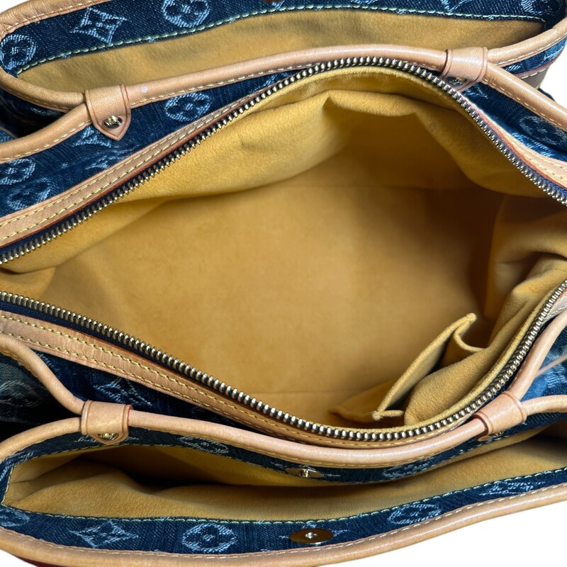 Louis Vuitton Porte Raye Epaule Denim MM<br />
<br />
Date Code: AR1006<br />
<br />
Dimensions:<br />
Length: 12.75 in<br />
Height: 8.5 in<br />
Width: 4.75 in<br />
Drop: 15 in<br />
<br />
In very good condition. Light patina to the leather and leather strap. Light marks on leather.<br />
<br />
Does not come with the original dust bag or box.