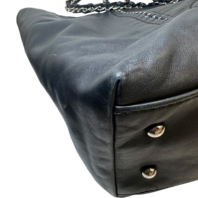 Chanel Luxe Line Leather Chain Tote<br />
<br />
Serial Code: Hologram worn off. Entrupy certificate provided.<br />
<br />
Dimensions:14 L x 9 H inches<br />
<br />
In very good condition.Some surface scratches on the leather and some corner wear.<br />
<br />
Does not come with the original dust bag or box.