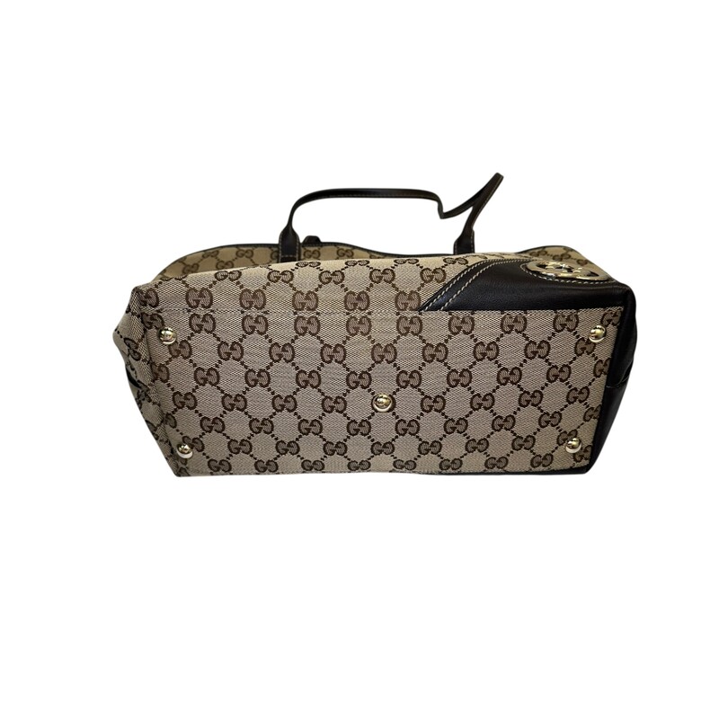 Gucci New Britt Canvas Tote Monogram Medium<br />
<br />
Code 169946 502752<br />
<br />
Dimensions:<br />
Base length: 10.75 in<br />
Width: 5.00 in<br />
Height: 9.00 in<br />
Drop: 7.75 in<br />
<br />
In very good condition. Light wear to the corners.<br />
<br />
Does not come with the original dust bag or box.