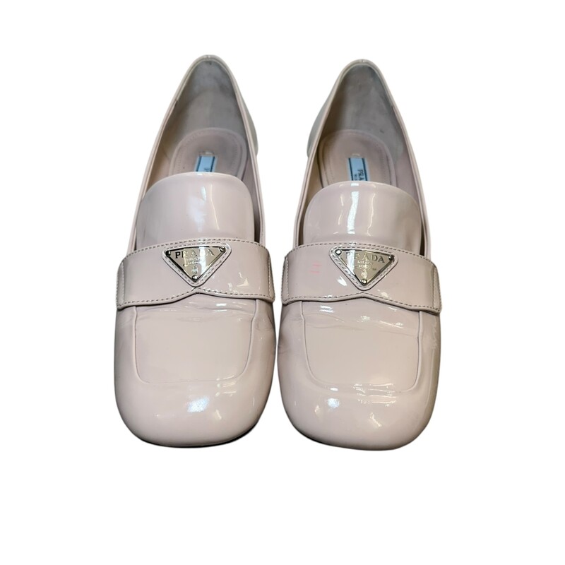 Prada Logo Loafer Patent Beige<br />
<br />
Size: 38.5<br />
<br />
In good condition. Creasing by the toes. Pink mark on left shoe and scuffing throughout the shoes.<br />
<br />
Does not come with the original dust bag or box.