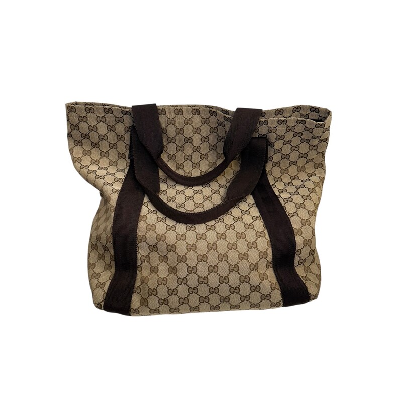 Gucci Vertical Canvas Tote Monogram<br />
<br />
Code: 189669 467891<br />
<br />
Dimensions:<br />
Base length: 10.25 in<br />
Height: 14 in<br />
Width: 6.5 in<br />
Drop: 5<br />
<br />
In ver good condition. Light wear to the bag.<br />
<br />
Does not come with the original dust bag or box.